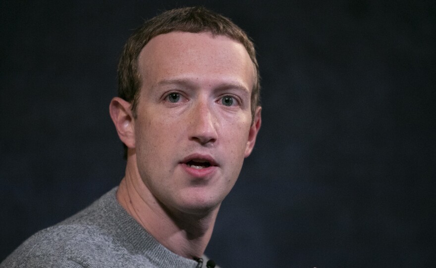 Mark Zuckerberg says Facebook will consider labeling some posts that break its rules, rather than simply taking them down or leaving them up.