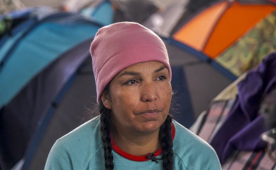 Migrant mother going by the name "Flor" from the Mexican state of Michoacán has been living at the Tijuana migrant shelter, Movimiento Juventud 2000, with her son and daughter for six months waiting on the migration app CBP One to show an available appointment, Dec. 10, 2024.