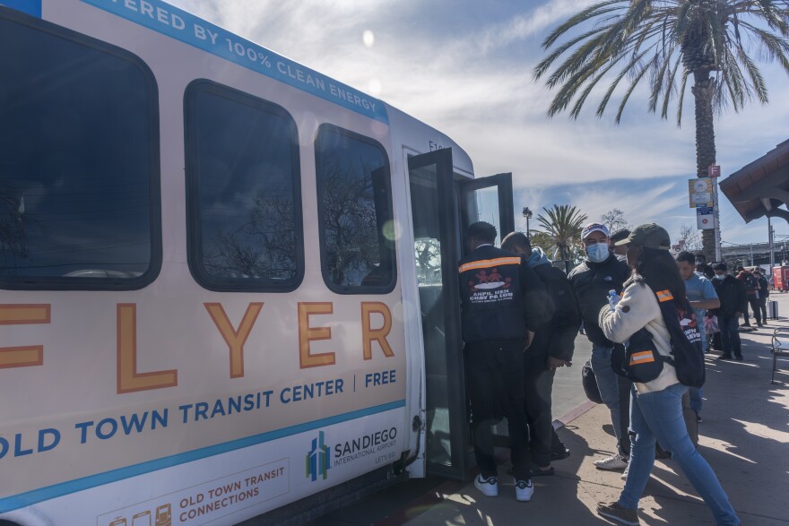 Migrants board the San Diego Flyer a free airport shuttle after border agents drop them off at San Diego transit centers. The migrant welcome center has closed and volunteers from several community organizations try to fill the gap as the asylum seekers make their way to their final destination throughout the United States, February 23, 2024.