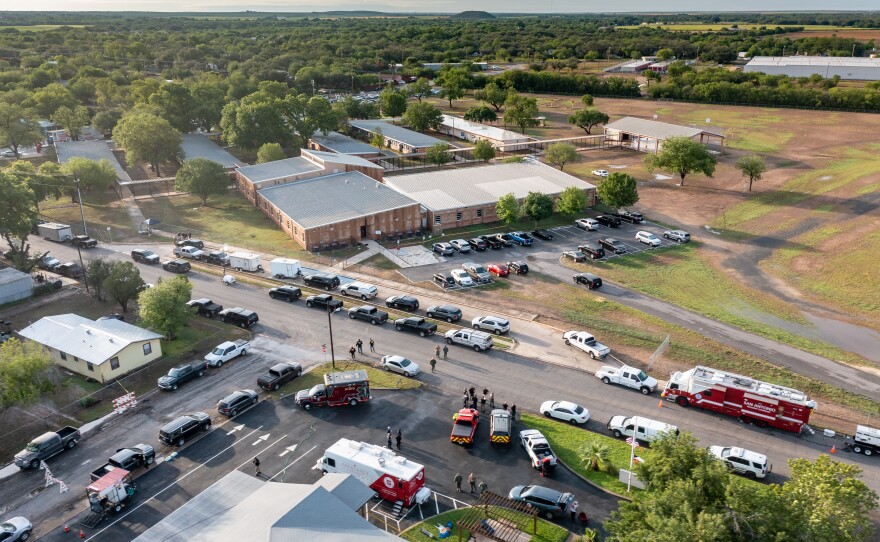 In this aerial view, law enforcement officials work on scene at Robb Elementary School on Wednesday.