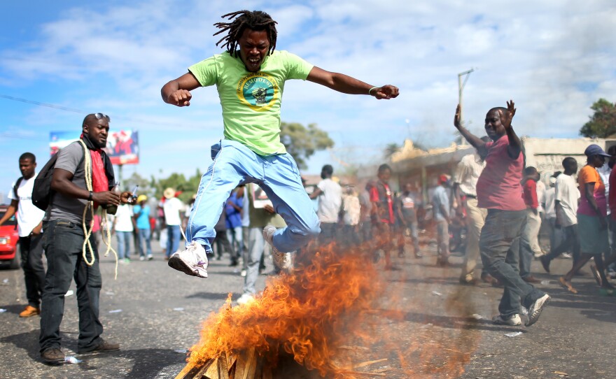 Haitians protested in the streets of Port-au-Prince on Sunday, calling for the resignation of President Michel Martelly.