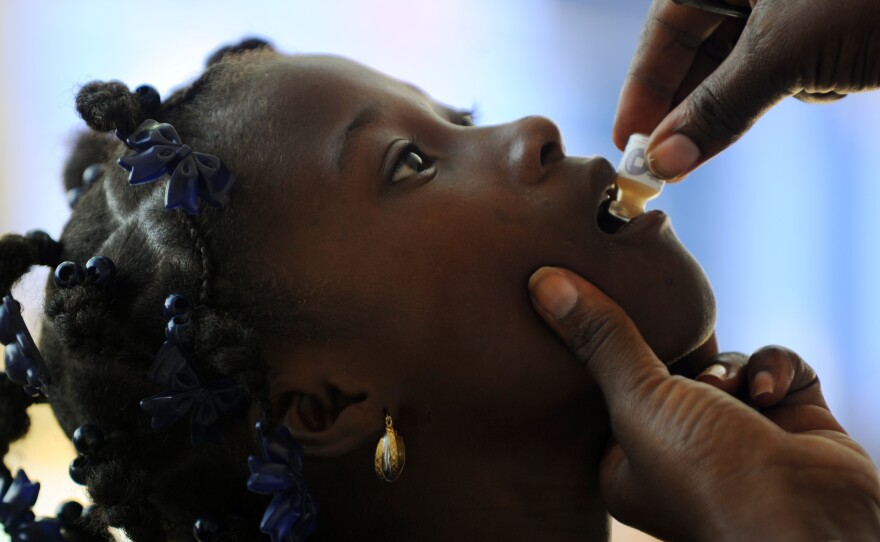 A child receives the second dose of the cholera vaccine in Saut d'Eau, Haiti, last September.