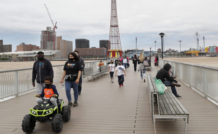 On Sunday, visitors strolled the pier at Coney Island beach. New York state parks reopened for the Memorial Day weekend at 50% capacity, and campgrounds were given the green light to reopen Monday.