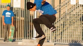 Jorge Robles shows off his skateboarding skills in front of Cherokee Point Elementary School before joining a rally for a formal skatepark in City Heights, Dec. 19, 2012.