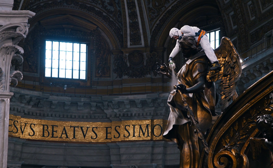 Sanpietrini cleaning within St. Peter's Basilica, inside the Vatican. Rome.
