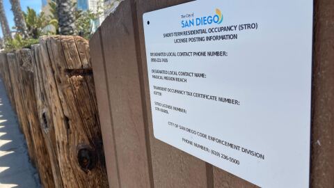 A sign posted outside a short term rental property in the Mission Beach neighborhood of San Diego on May 3, 2023.