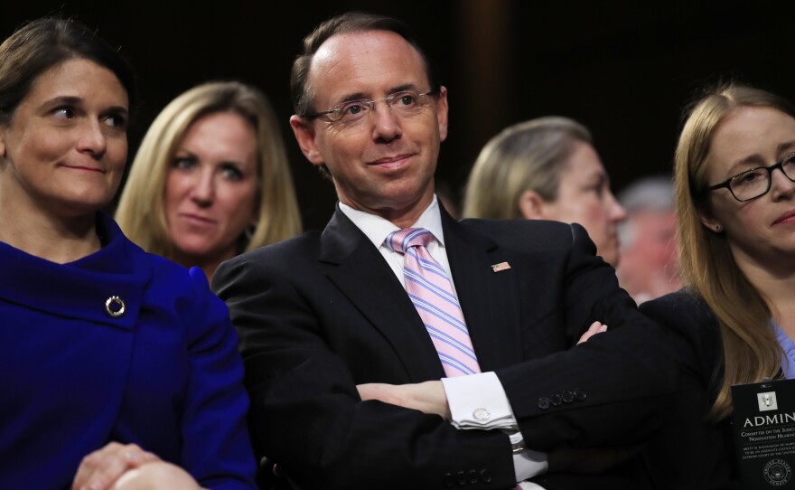 Deputy Attorney General Rod Rosenstein, center, may get a reprieve after a scare this week in which he expected to be fired.
