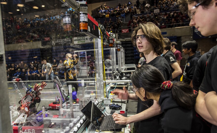 Theo Gerst, 18, checks Berkelium's targeting camera and autonomous functions before a playoff match at the 2023 Sacramento Regional.