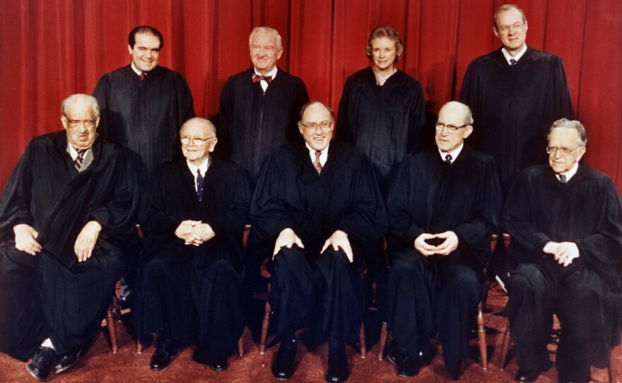 Members of the U.S. Supreme Court pose for a formal portrait in Washington in 1988. (From left, front row) Associate Justices Thurgood Marshall; William Brennan, Jr.; Chief Justice William Rehnquist; Byron White; and Harry Blackmun. (Back row, from left) Antonin Scalia; John Paul Stevens; Sandra Day O'Connor and Anthony M. Kennedy.