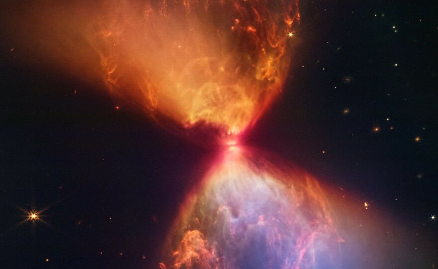 Webb captures the image of a protostar, the very beginning of a new star. The "hourglass" of dust and gas clouds is only visible in infrared light, the wavelengths Webb specializes in.