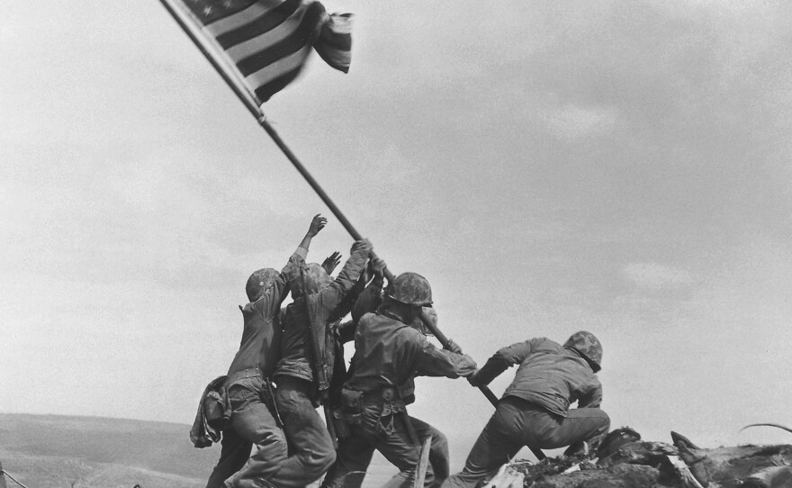 U.S. service members raise the American flag atop Mt. Suribachi in Iwo Jima, Japan, on Feb. 23, 1945. The Marine Corps is investigating whether some of the men in the photo have been misidentified.