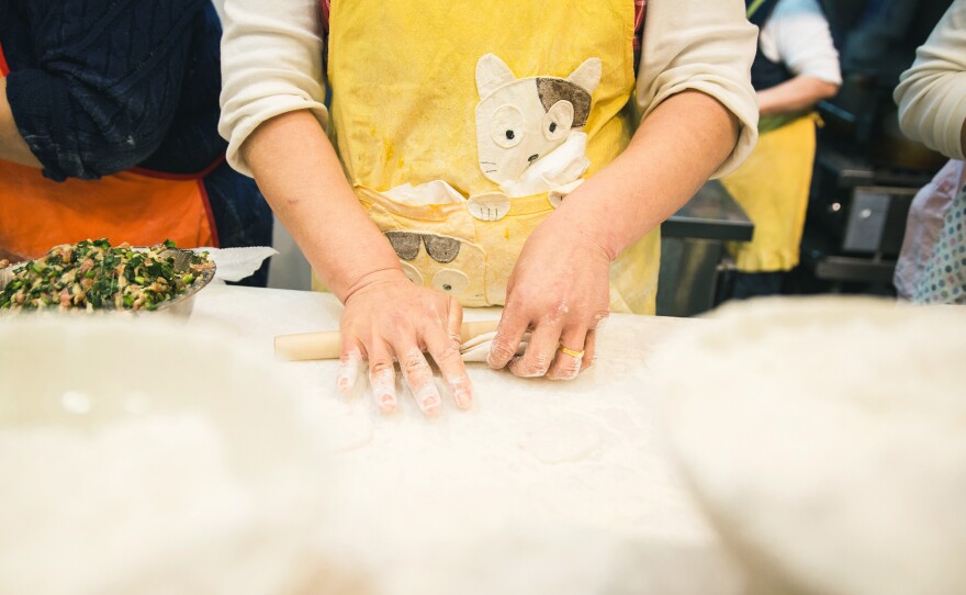 Freshly made Chinese-Korean-style dumplings are made at a food stall in the New World Mall in Flushing.