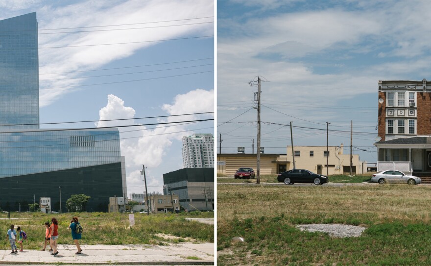 Left: A family walks by Ocean Resorts Casino on the north side of the Atlantic City Boardwalk in Atlantic City, New Jersey on Thursday. Right: A house stands on the north side of the Atlantic City Boardwalk in Atlantic City, New Jersey on Thursday.