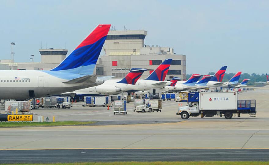 Delta planes line up at the terminal at Hartsfield-Jackson Atlanta International Airport. Southwest Airlines will begin serving the city next month, and hopes to lure passengers away from the hometown airline.