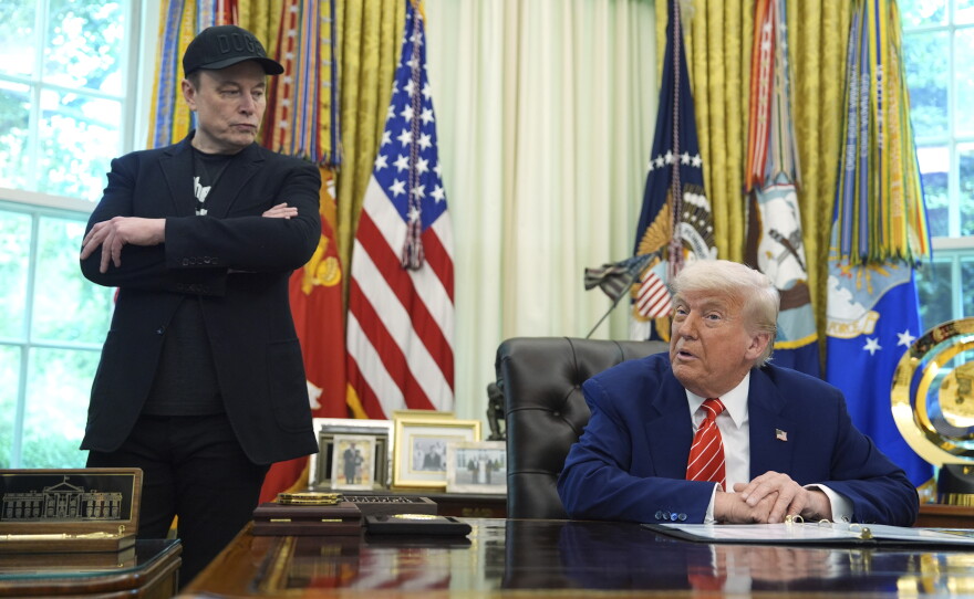 President Donald Trump, right, speaks during a news conference with Elon Musk in the Oval Office of the White House, Friday, May 30, 2025, in Washington.
