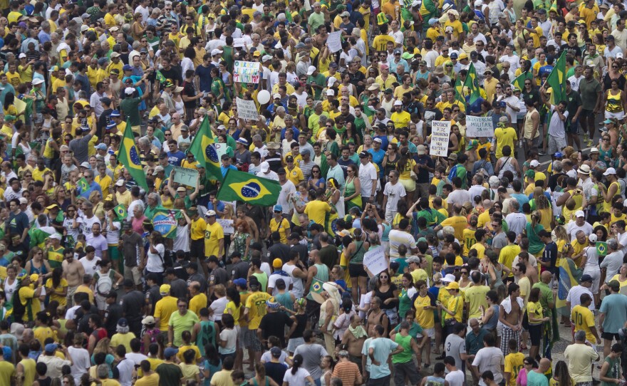 People gather in Copacabana beach during a protest against Brazil's President Dilma Rousseff in Rio de Janeiro, Brazil, on Sunday.