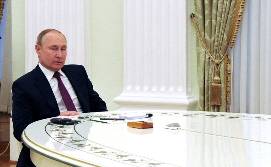 Russian President Vladimir Putin speaks to German Chancellor Olaf Scholz during their talks in the Kremlin in Moscow, Russia, on Feb. 15.