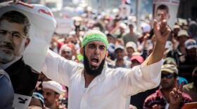 Protesters in Cairo march in support of ousted Egyptian President Mohammed Morsi, who won Egypt’s first free and fair elections in June 2012, but was overthrown by the military a year later.
