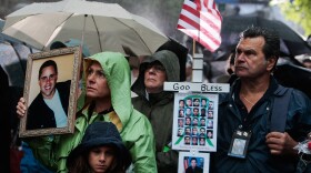 Relatives of victims stand before a ceremony marking the eighth anniversary of the 9/11 terrorist attacks on the World Trade Center on September 11, 2009 in New York City. 