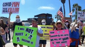 People in Pacific Beach on April 26, 2020, protesting the shelter-in-place order designed to stop the spread of the coronavirus.