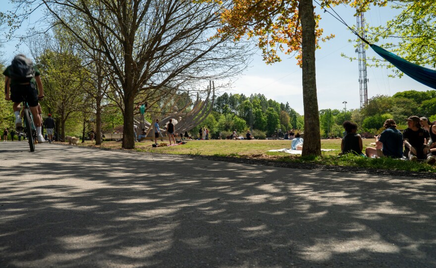 Spectators gather near the Beltline in Atlanta's Old Fourth Ward to view the solar eclipse.