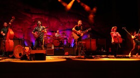 The Avett Brothers performing in the stunning natural setting of Colorado’s Red Rocks Park and Amphitheatre.