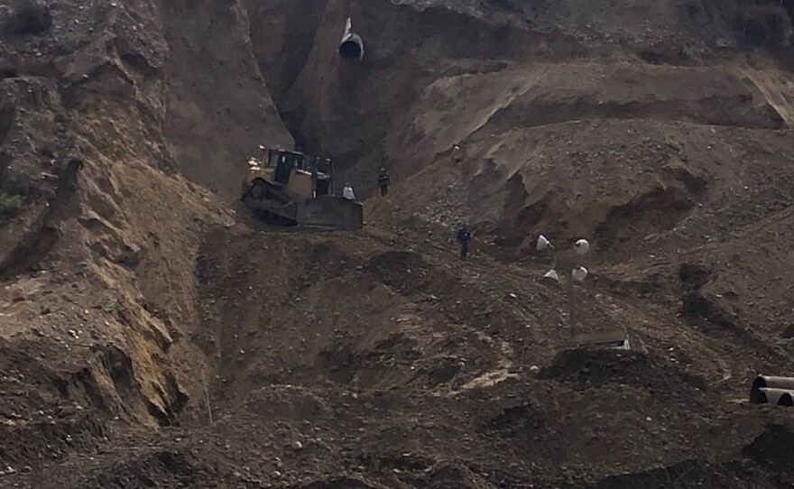 Mexican crews repair hillside under sewage pipe break in this undated photo