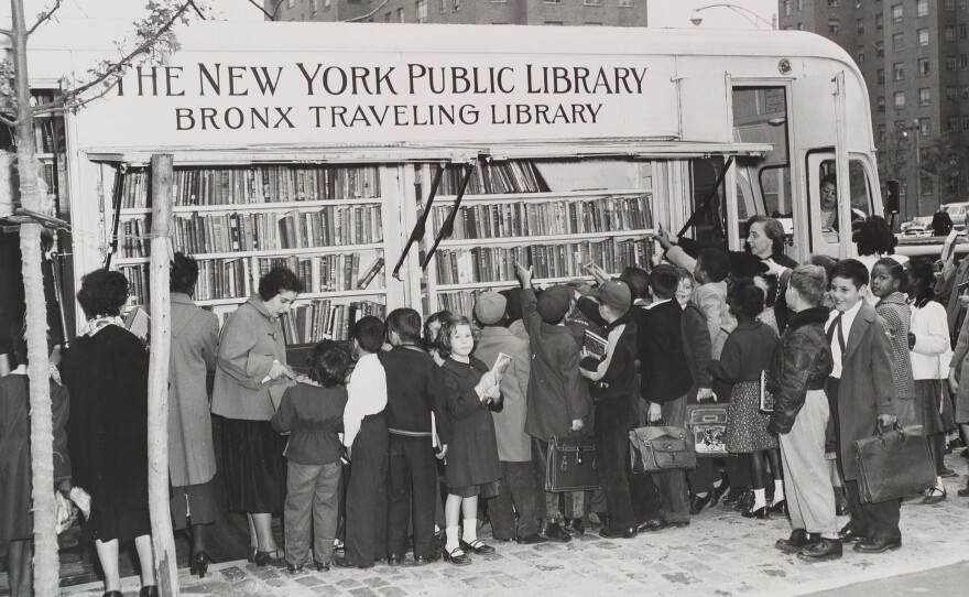 Children in the Bronx visit a New York Public Library bookmobile in the 1950s. The institution turns 125 this year.