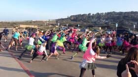 Runners wearing tutus warm up before Girls on the Run's "Joyful Tutu Run" on Saturday in Torrey Pines. The run was organized to show solidarity with Monika Allen, a runner who was mocked by SELF Magazine.