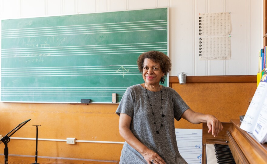 June Collins Pulliam poses for a portrait in a classroom at Fanfare Lutheran Music Academy.
