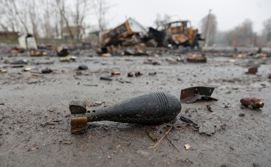 A mortar shell is seen next to a destroyed military vehicle in Nova Basan on April 1.