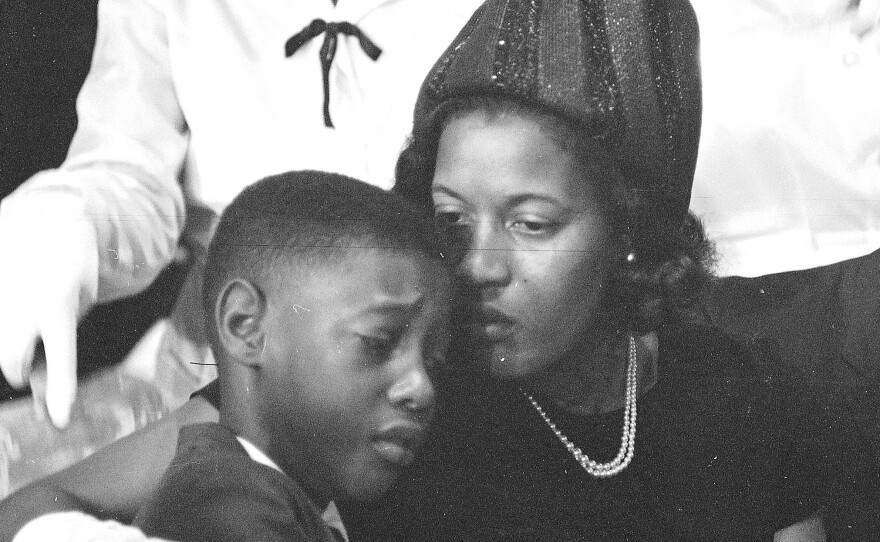 Medgar Evers' widow, Myrlie, comforts the couple's 9-year-old son, Darrel, at her husband's funeral in Jackson, Miss., on June 15, 1963.
