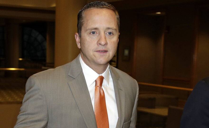 The University of Miami's athletic director, Blake James, walks to an NCAA Committee on Infractions hearing in Indianapolis in June. The school's failings "enabled a culture of noncompliance," the NCAA said Tuesday, in announcing penalties for the school and its football and men's basketball coaches.