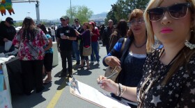 Caroline Maya, a 21-year-old college student, registers to vote for the first time at the Latinos for Obama booth outside the Grand Sierra Casino in Reno, Nev., Saturday.