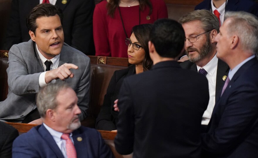Rep. Matt Gaetz, R-Fla., talks to Rep. Kevin McCarthy, R-Calif., after Gaetz voted "present" in the House chamber.