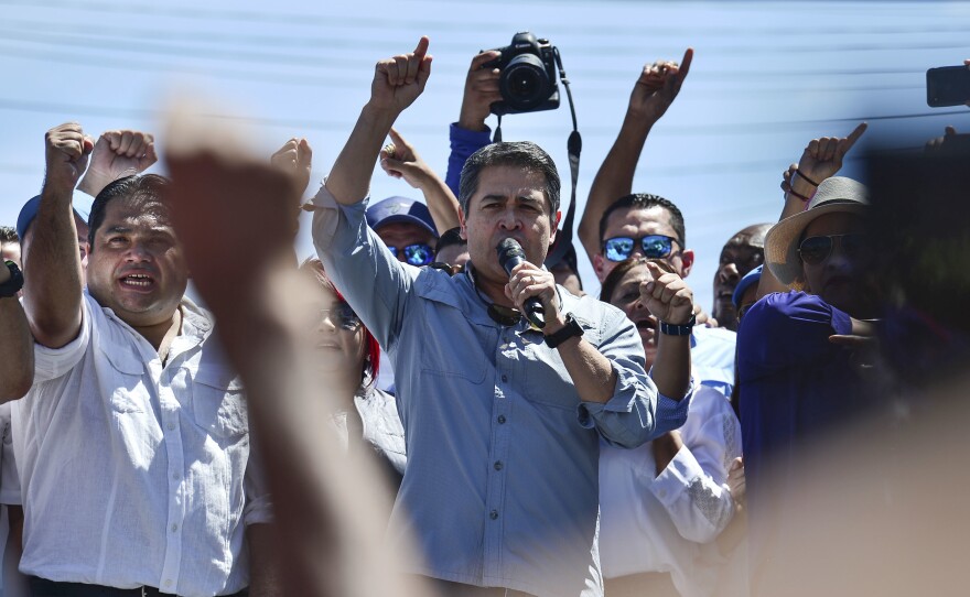 Honduran President Juan Orlando Hernández speaks to his supporters in Tegucigalpa, on Oct. 20, 2019. He spoke after opposition parties in Honduras accused him of running a drug and corruption network and called for street protests to demand the president step down.