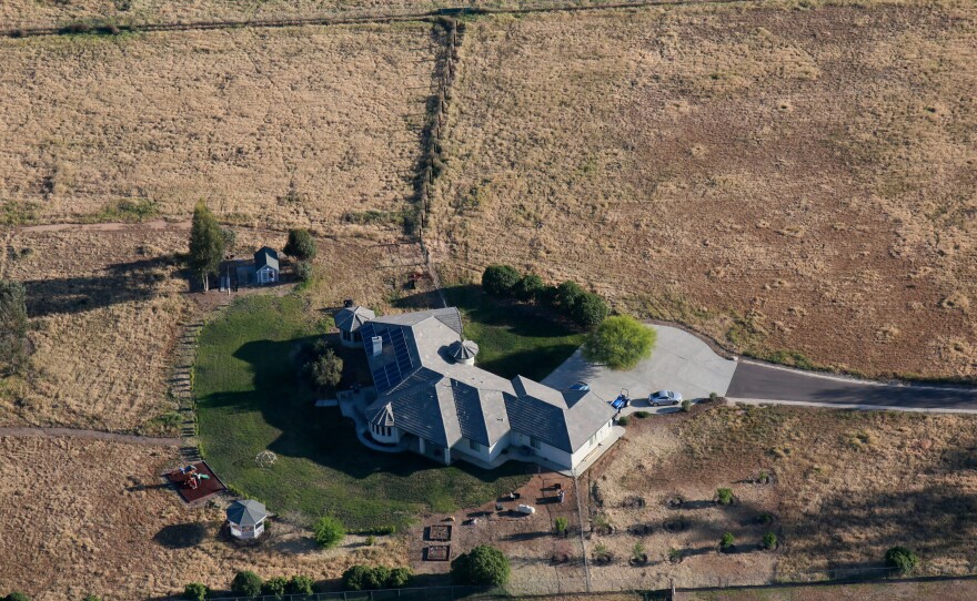 Parched land surrounds landscaping in Carlsbad, Calif. Jerry Brown, the state's governor, announced "unprecedented" new water restrictions last week.