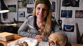 Dr. Cat. Jarman, a bioarchaeologist and field archaeologist, with a collection of Viking archelogical finds. 