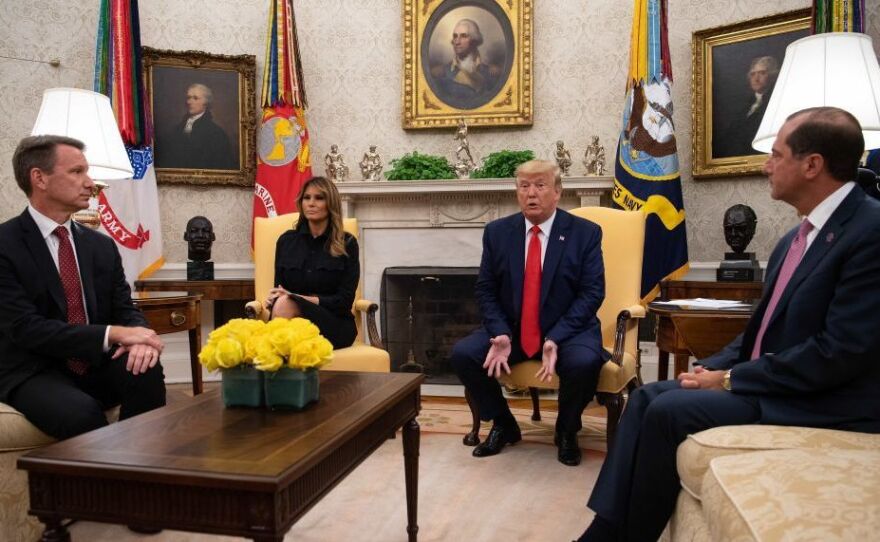 President Trump speaks to the press with first lady Melania Trump and Acting Food and Drug Administration Commissioner Norman Sharpless (left) and Health and Human Services Secretary Alex Azar in the Oval Office at the White House on Wednesday.