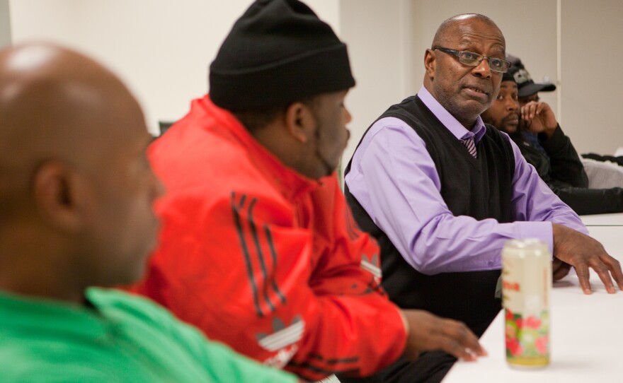 Facilitator Eddie White speaks during meeting.