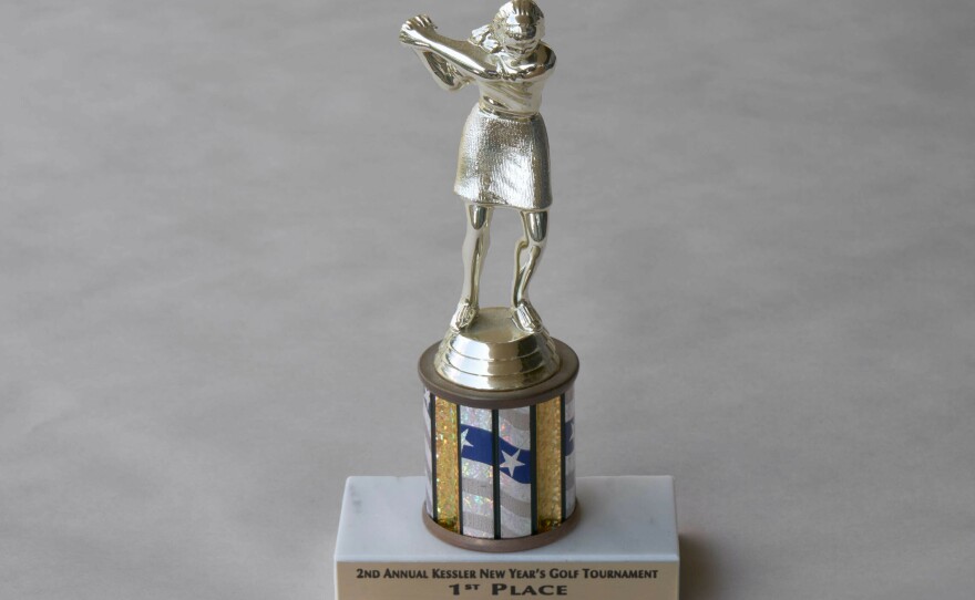 A 1st Place golf trophy from 2005. Audrey was an avid golfer. Her trophies were kept on her shelves. Some of the people who worked at the assisted living facility loved talking to her about golf, as did her doctors.