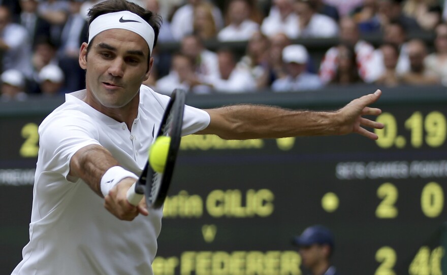 Switzerland's Roger Federer defeated Croatia's Marin Cilic to win his record eighth men's singles title at the Wimbledon Tennis Championships in London Sunday.