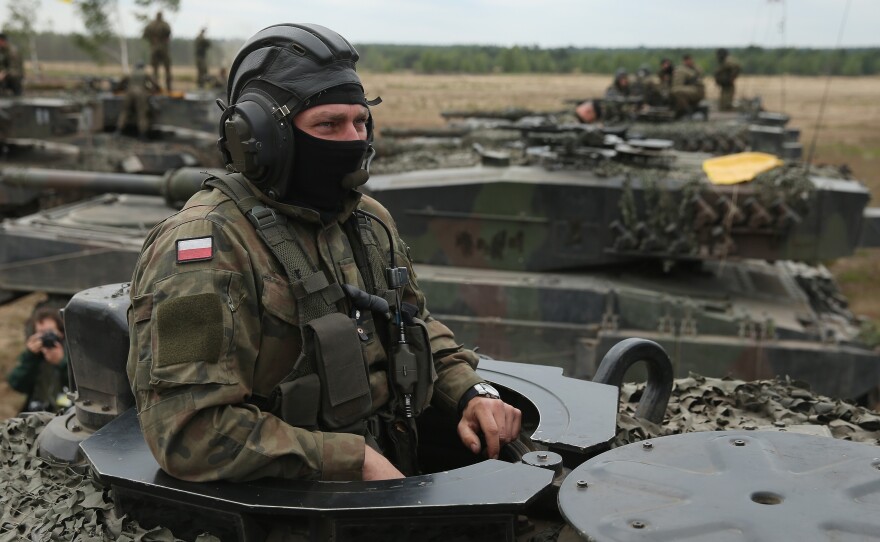 Soldiers of the Polish Army man their Leopard 2 tanks during the NATO Noble Jump military exercises of the VJTF forces on June 18, 2015 in Zagan, Poland.