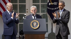 Judge Merrick B. Garland is flanked by President Barack Obama and Vice President Joe Biden as he is introduced as Obama's nominee for the Supreme Court, March 16, 2016. 