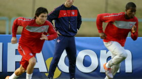 U.S. coach Bob Bradley watches over his players.