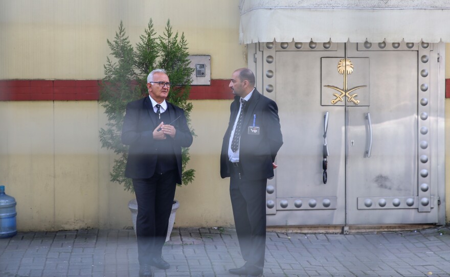 Officials stand outside the Saudi consulate in Istanbul, where Saudi journalist Jamal Khashoggi was last seen alive.