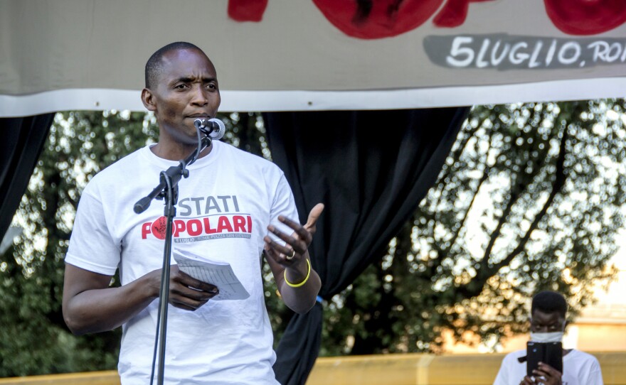 Aboubakar Soumahoro speaks at a protest in Rome last month. "If the workers lack dignity and rights, the food they provide is virtually rotten," he says in a new short documentary, The Invisibles.