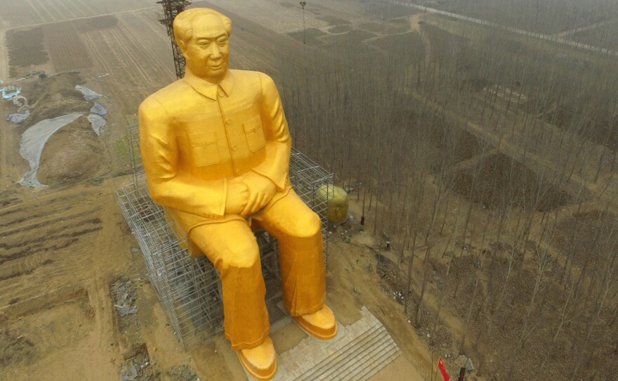 The huge statue of Chairman Mao Zedong in central China's Henan province before it was demolished.