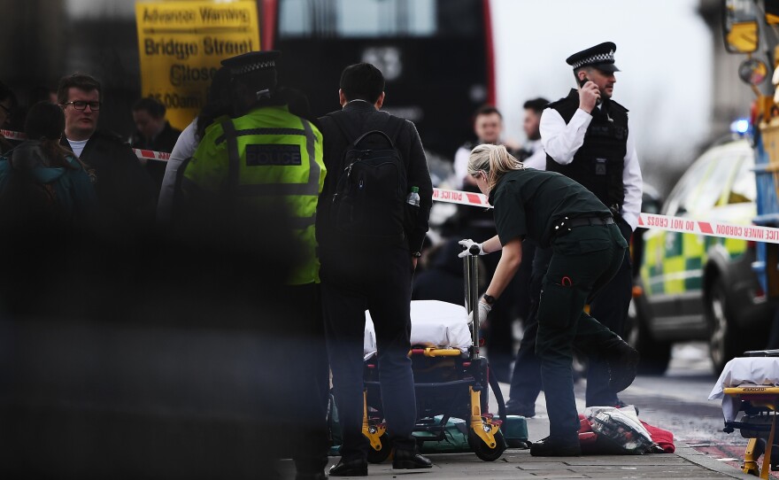 Medical staff near Westminster Bridge on Wednesday in London, where the U.K. House of Commons is under lockdown.