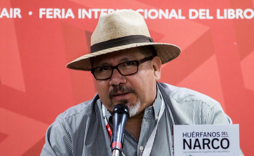 Mexican journalist Javier Valdez speaks at the International Book Fair in Guadalajara, Mexico, in 2016. He was killed by a gunman on Monday.